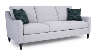 Measures 87"W x 41"D x 37"H and is available in a variety of fabrics, leathers, and leg finishes as well as cushion options. Also available as a loveseat, chair, and sectional configurations. Starting at $2.749 in fabric and $3,889 in leather. Light Gray Sofa