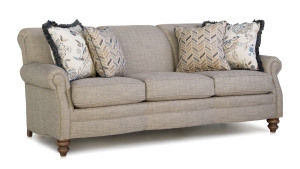 Measures 84" x 40" x 35"H and is available in a variety of fabrics, leathers, and leg finishes. Also available as a loveseat, chair, with matching ottoman. Starting at $2,449 in fabric and $3,479 in leather. Tan Sofa