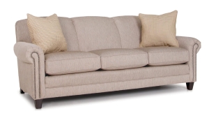 Measures 86" x 37" x 36"H and is available in a variety of fabrics, leathers, and leg finishes. Also available as a loveseat, chair, with matching ottoman. Starting at $2,459 in fabric and $3,539 in leather. Tan Sofa